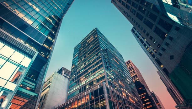 Modern office buildings representing the commercial context of Nevens Consulting EA.
